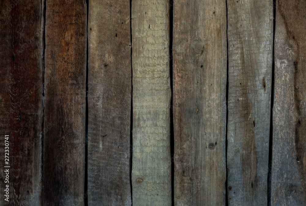 Wooden background of old boards painted with paint. Old wooden fence Wooden background of old boards painted with paint. Old wooden fence