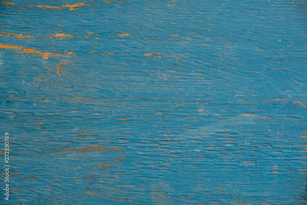 Wooden old cracked background painted blue paint. Wooden old cracked background painted blue paint.