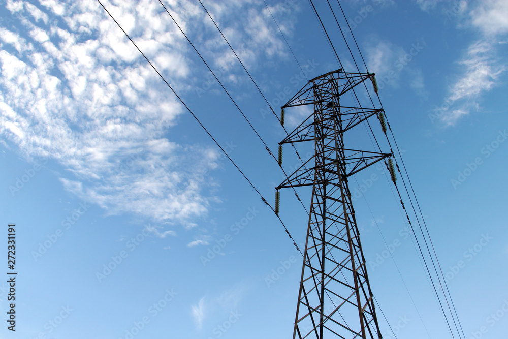 power transmission tower on background of blue sky