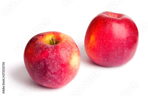 Two red ripe juicy apples on white isolated background