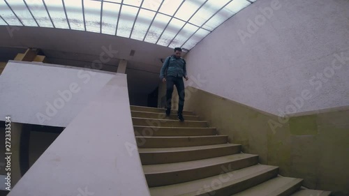 Man in dark boots and jeens going up the concrete stairs tourist travel city outdoors people street tourism beautiful building europe guy lifestyle urban view architecture slow motion