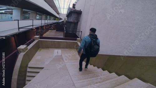 Man in dark boots and jeens descends down the stairs tourist travel city outdoors people street tourism beautiful building europe guy lifestyle urban view architecture slow motion