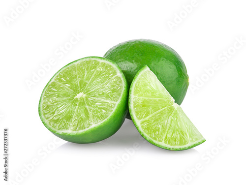 Limes with slices and leaves isolated on white background.