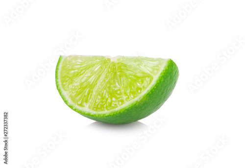 Juicy slice of lime isolated on white background.
