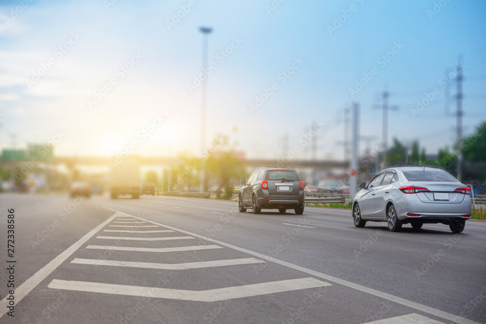 Car Driving on High Way Road And Blue Sky Background
