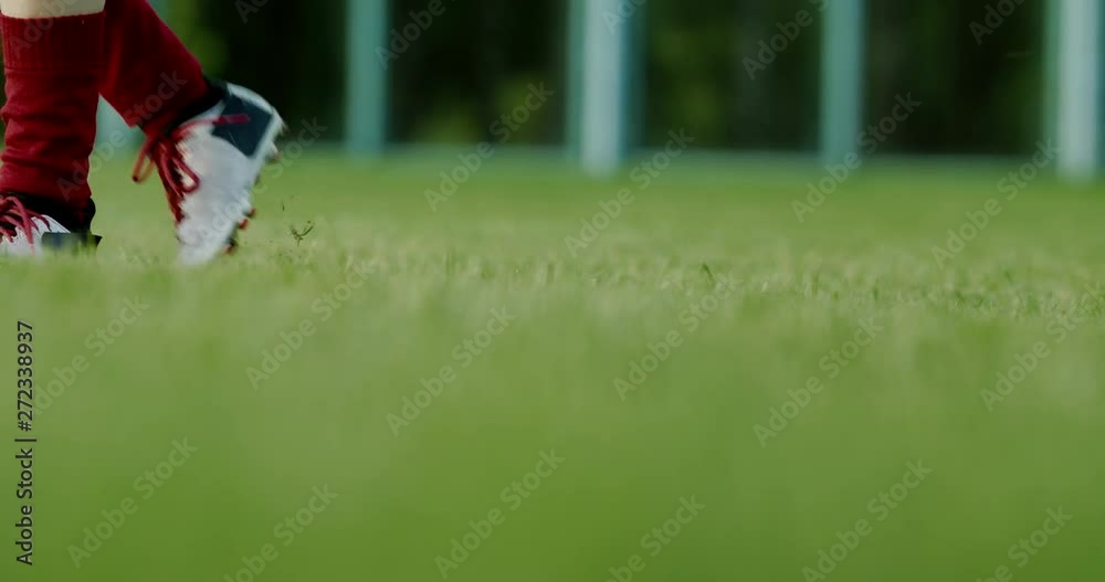 CU of young Caucasian teenager girl soccer football performing penalty shot, kicking a ball. 4K UHD 60 FPS SLOW MOTION CU of young Caucasian teenager girl soccer football performing penalty shot, kicking a ball. 4K UHD 60 FPS SLOW MOTION
