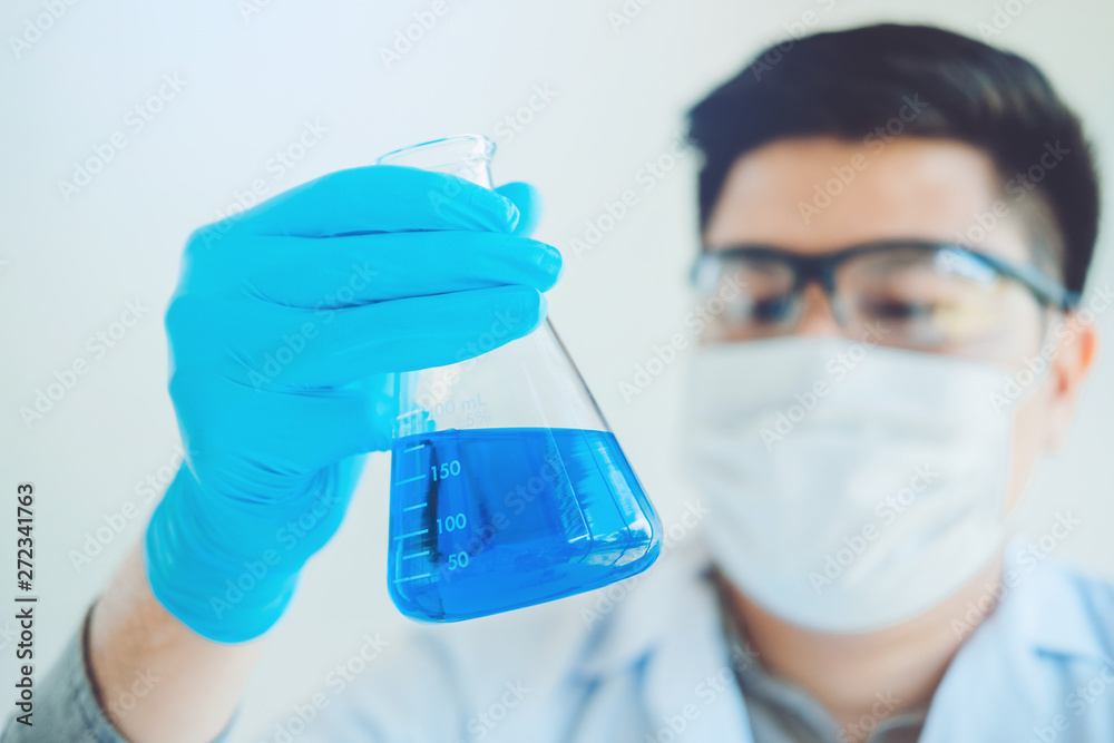 Scientist with equipment holding tools during scientific experiment science concept Scientist with equipment holding tools during scientific experiment science concept