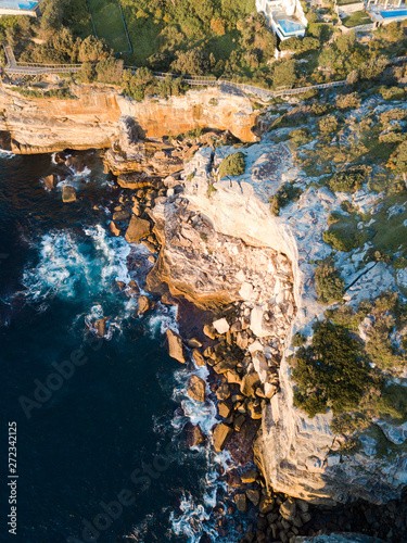 Top down aerial view of a rock cliff.