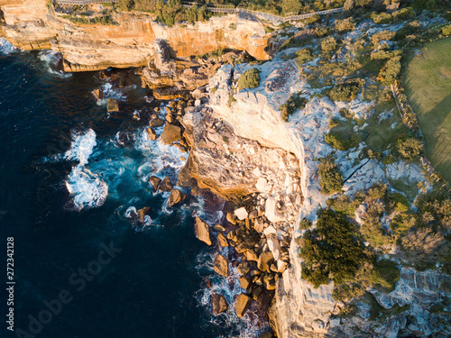 Top down aerial view of a rock cliff.