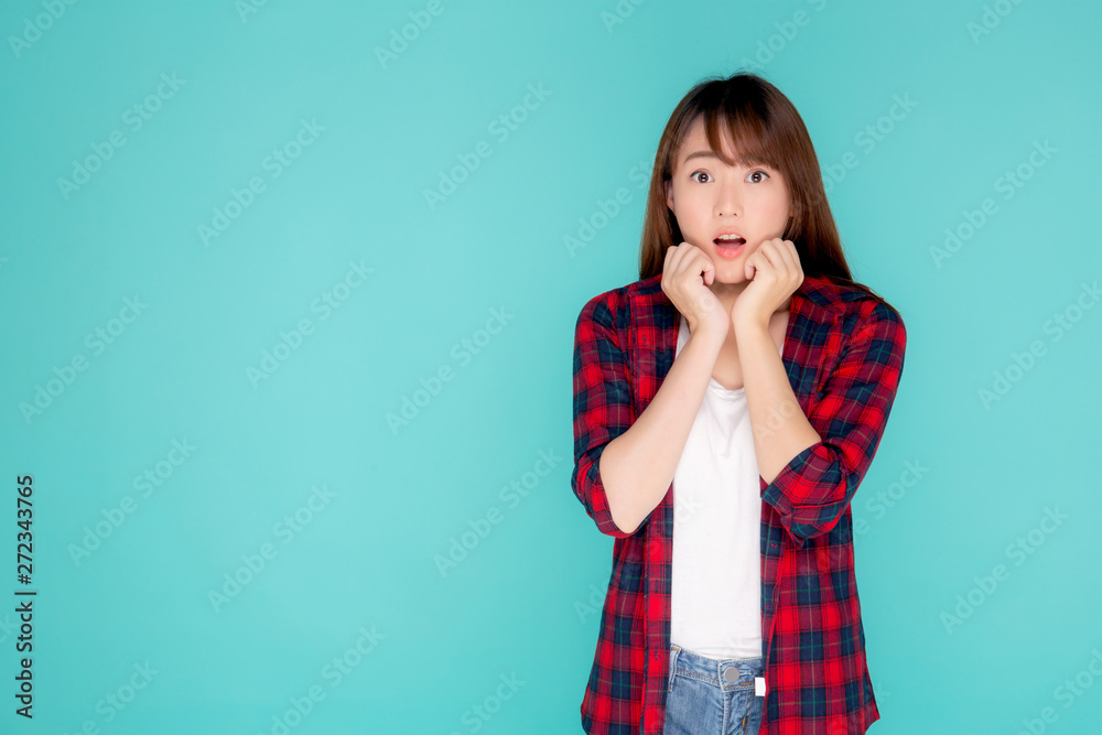 Beautiful portrait young asian woman surprise wearing travel summer fashion with tourist in vacation isolated on blue background, girl shocked expression and emotion, tourist, holiday amazing concept. Beautiful portrait young asian woman surprise wearing travel summer fashion with tourist in vacation isolated on blue background, girl shocked expression and emotion, tourist, holiday amazing concept.
