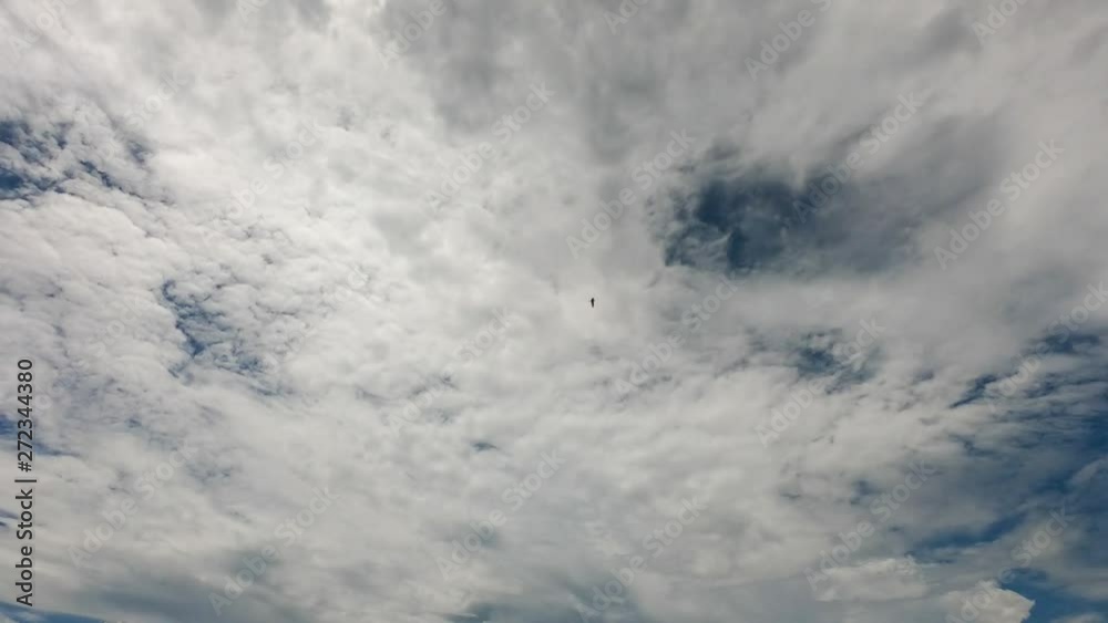 Time lapse of white clouds with blue sky in background Time lapse of white clouds with blue sky in background