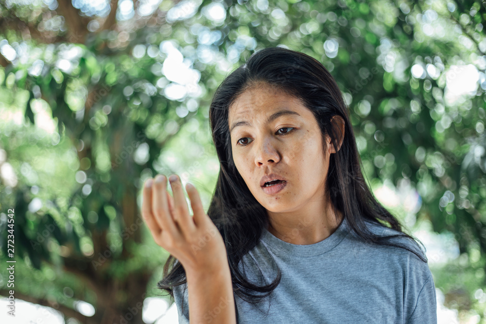 Young asian woman looking lost hair in hand . problem lost hair Young asian woman looking lost hair in hand . problem lost hair