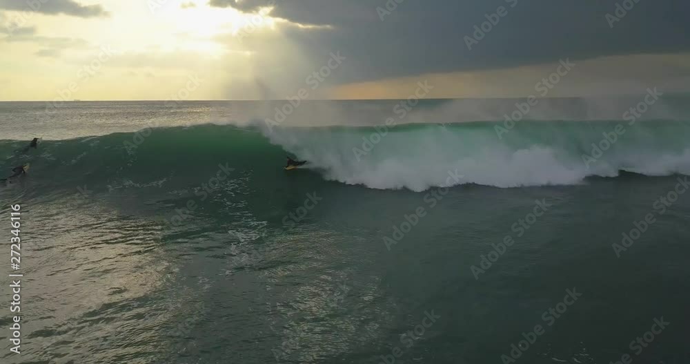 Drone shot of a bodyboarder catching a wave off the cornish coastline in porthleven on a big wave day Drone shot of a bodyboarder catching a wave off the cornish coastline in porthleven on a big wave day