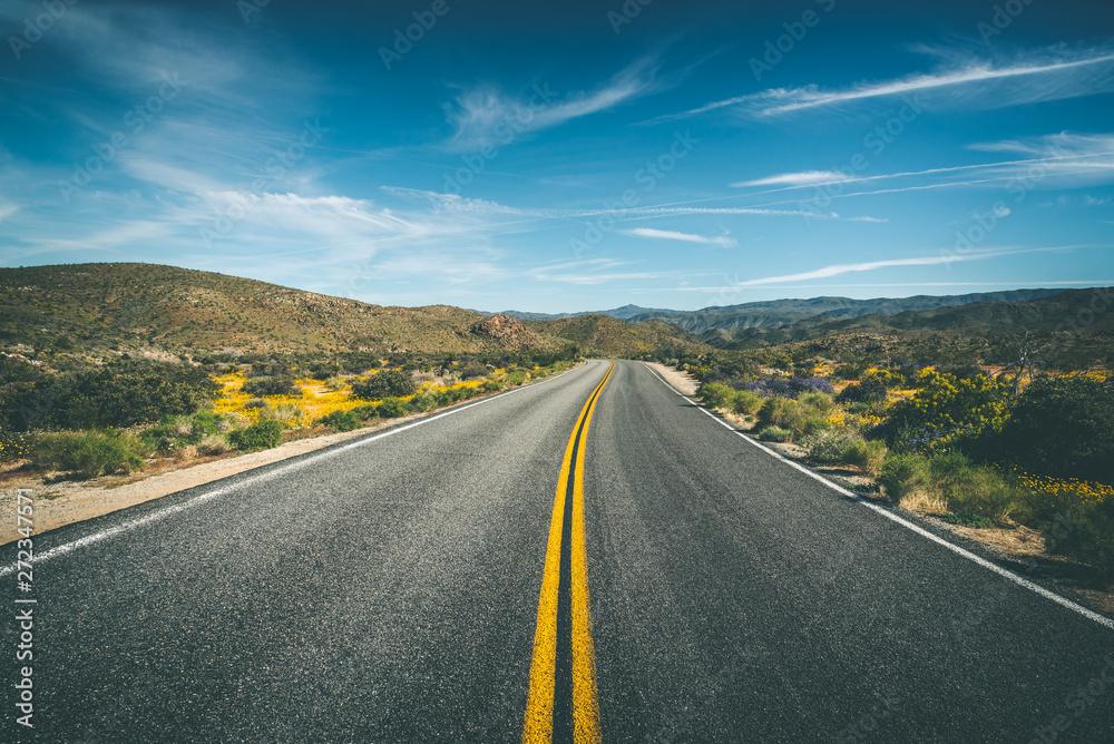 Long desolate highway road through California's desert Long desolate highway road through California's desert
