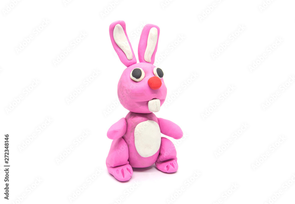 Fototapeta premium Play dough rabbit on white background. Handmade clay plasticine