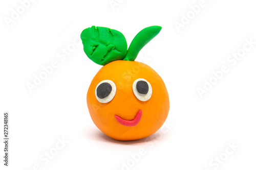 Play dough orange on white background. Handmade clay plasticine photo