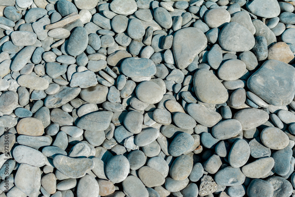 Pebble beach on a sunny summer day, background, selective focus Pebble beach on a sunny summer day, background, selective focus