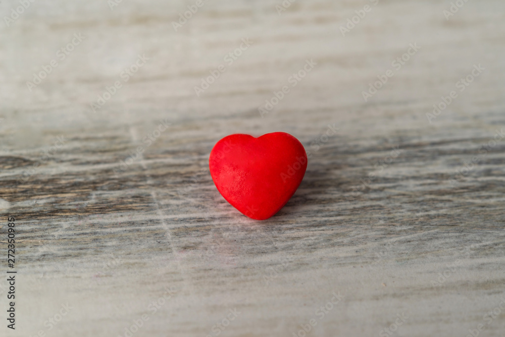 Fototapeta premium Colorful red and pink hearts against rustic white background. Concept of love, Saint Valentine day, healthy lifestyle, heart disease, and relationships