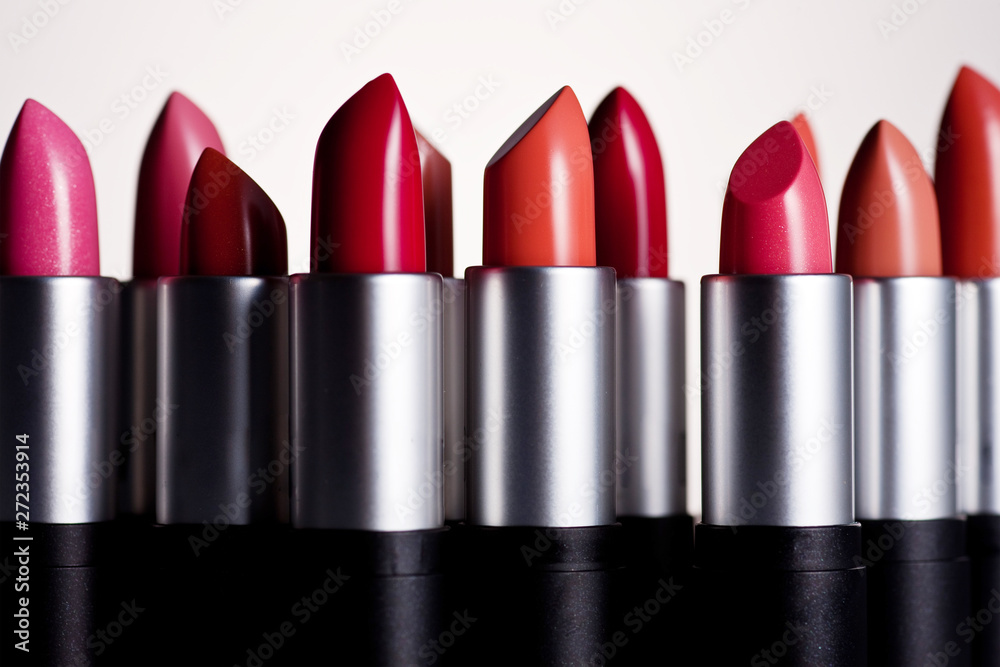 any of various colored lipstick in a case made of black plastic and steel. any of various colored lipstick in a case made of black plastic and steel.