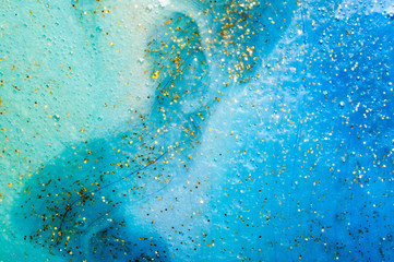 Background transparent slime with golden glitter