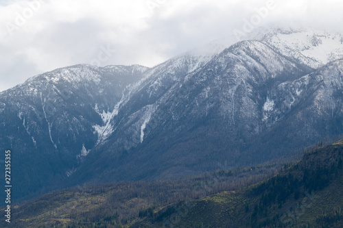 Snowy mountain peaks in the clouds near Lytton, British Columbia, Canada