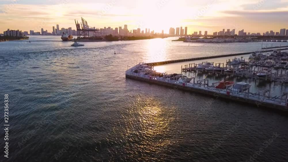 Drone shot of Port of Miami and Downtown Miami at sunset with Fisher Island ferry
