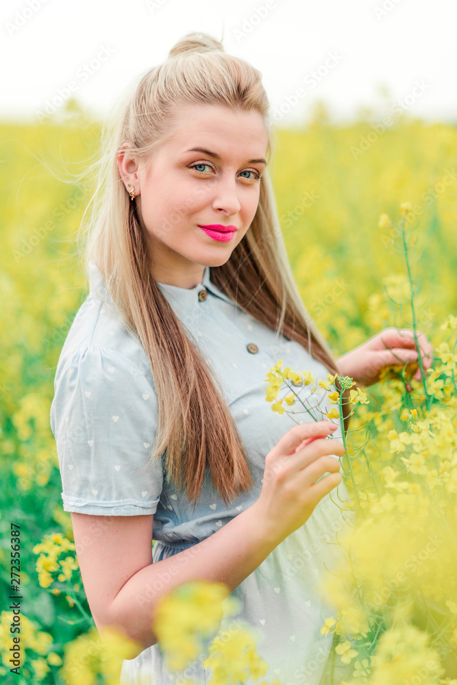Beautiful young blonde girl poses for the camera in rape Beautiful young blonde girl poses for the camera in rape