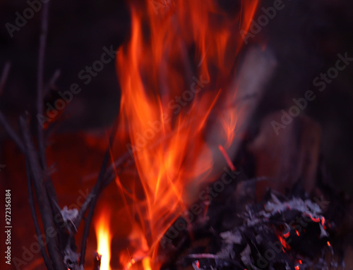 Background of a red flame of a fire at night. Cropped shot, horizontal, close-up, free space. The concept of forest safety.