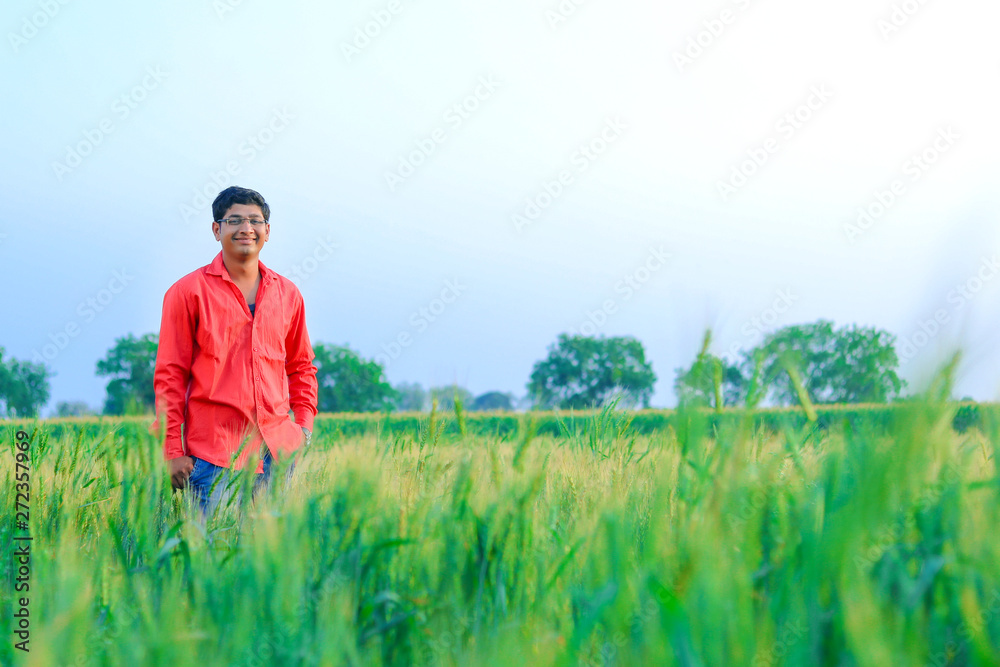 Young indian farmer at field