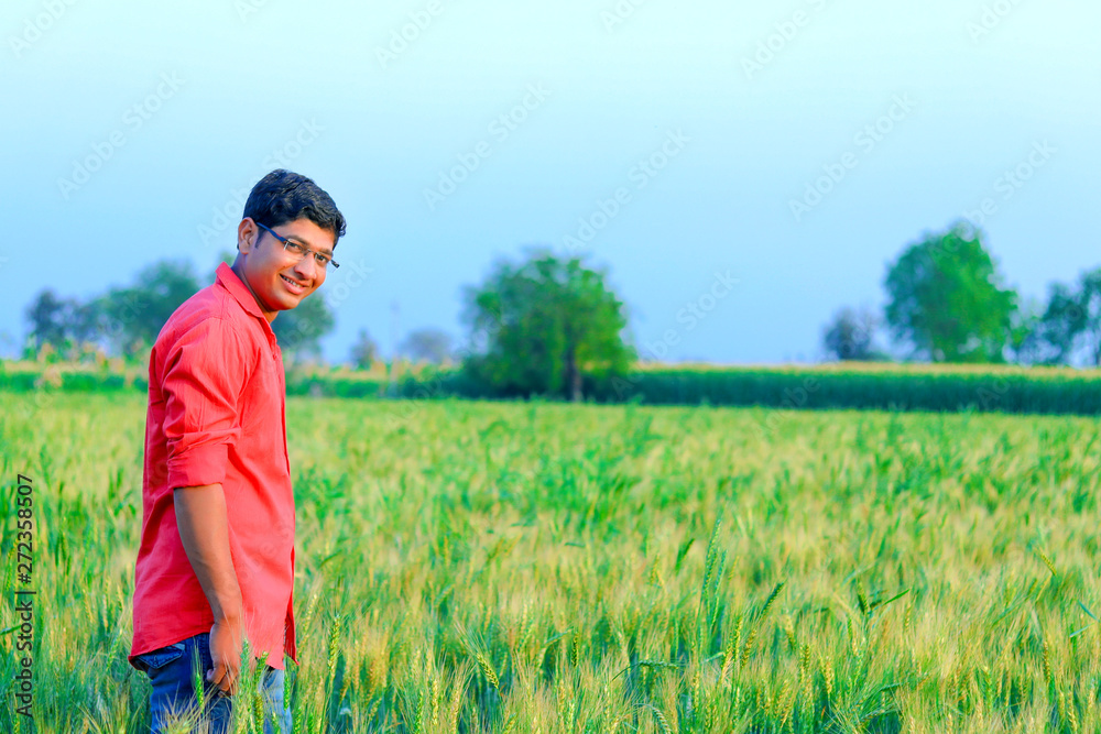 Young indian farmer at field Young indian farmer at field