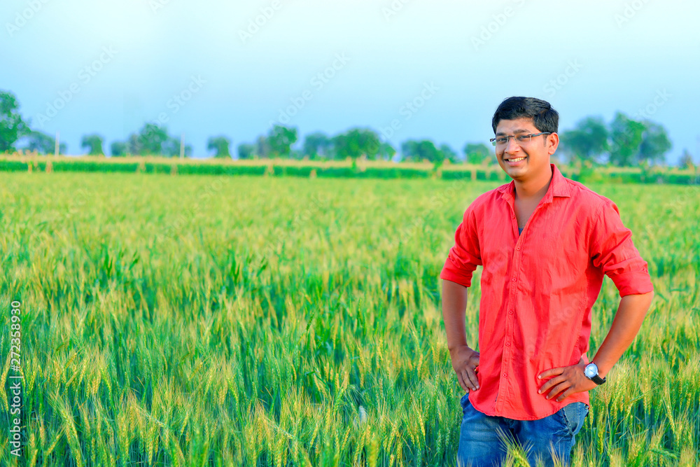 Young indian farmer at field Young indian farmer at field