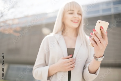 Portrait of a young girl holding a mobile phone.