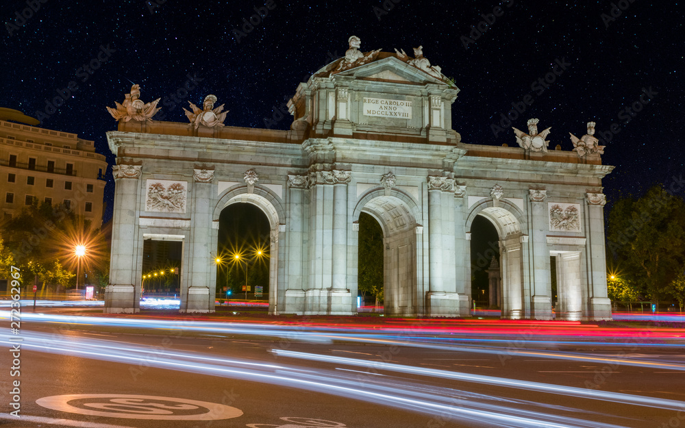 View of Puerta de Alcala at night with a starry sky, Madrid, Spain