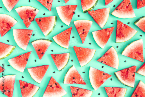 Watermelon pattern. Red watermelon on mint background. Summer concept. Flat lay, top view, copy space