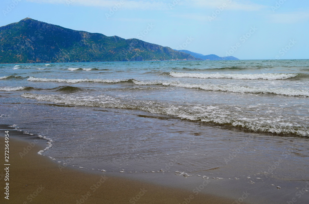 waves on the Mediterranean Sea on the shore of a turtle island in Dalyan, Turkey