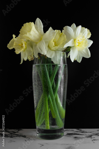 Bouquet of narcissus. Spring flowers. Black and marble background