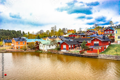 Scenic view of the Finnish city of Parvoo. Neat outbuildings. Spring nature. Multicolored buildings along the city promenade.