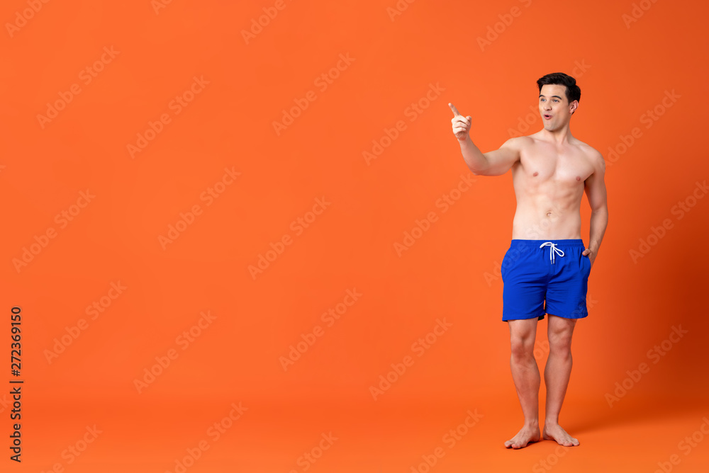 Fototapeta premium Amazed shirtless mascular caucasian man pointing his finger