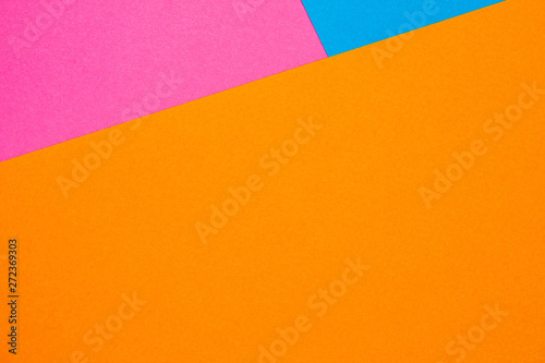 Background (texture) of orange, pink and blue paper