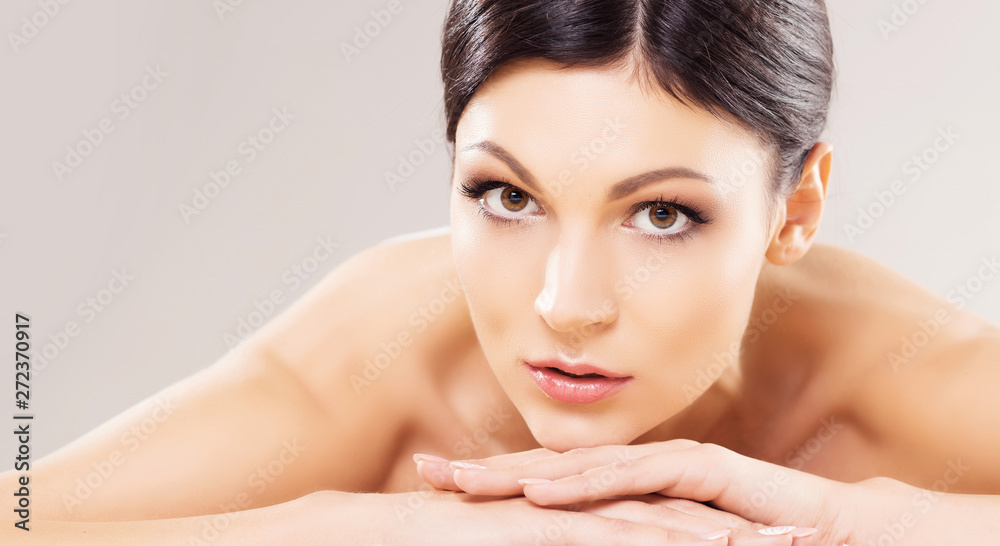 Beautiful, young and healthy woman in spa salon. Massage treatment over grey background. Spa, health and healing. Beautiful, young and healthy woman in spa salon. Massage treatment over grey background. Spa, health and healing.
