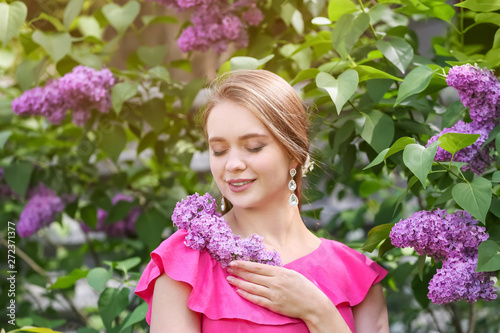 Beautiful young woman near ...