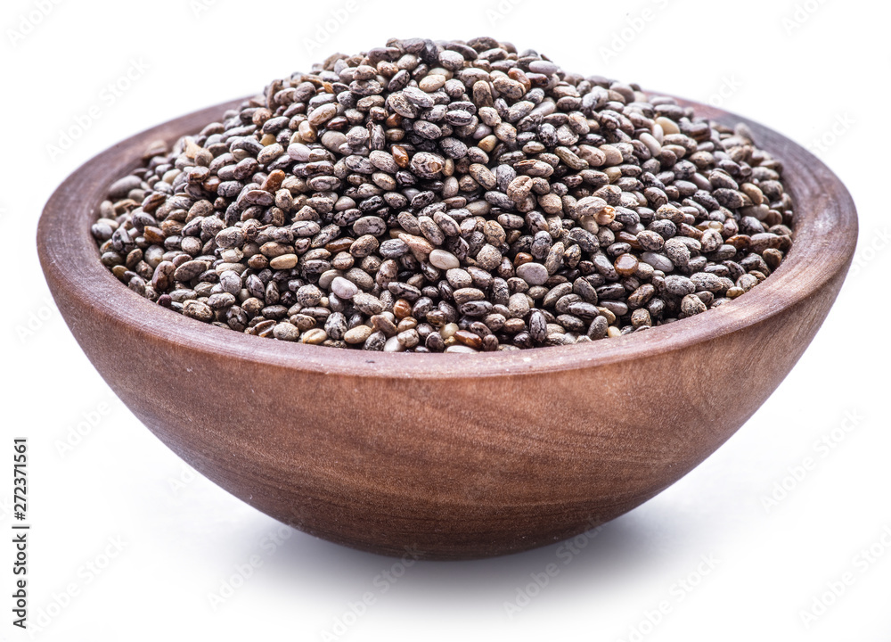Chia seeds in wooden bowl isolated on white background. Chia seeds in wooden bowl isolated on white background.
