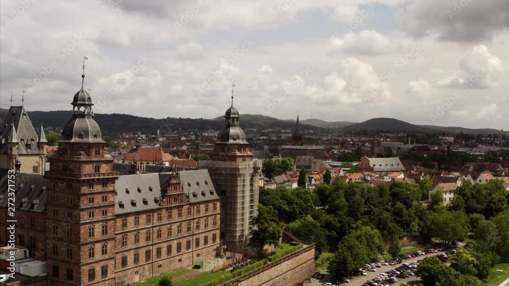 Flying back form the Castle Johannisberg in Aschaffenburg in a smooth aerial shot. The river Main can be seen in the foreground. Flying back form the Castle Johannisberg in Aschaffenburg in a smooth aerial shot. The river Main can be seen in the foreground.