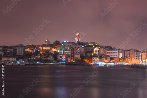 Istanbul cityscape at night, scenic view of city in lights with Galata tower and Golden Horn bay, Bosphorus, Turkey. Outdoor travel background
