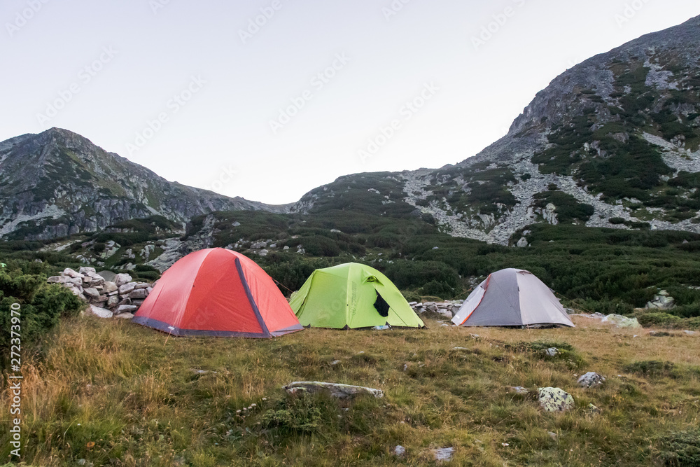 three tents in the mountains