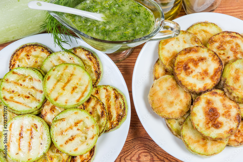 Grilled and fried in batter vegetable marrows with garlic sauce Grilled and fried in batter vegetable marrows with garlic sauce