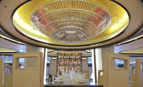 Private dining table with chandelier inside dining room on Princess Cruises cruiseship Royal Princess photo