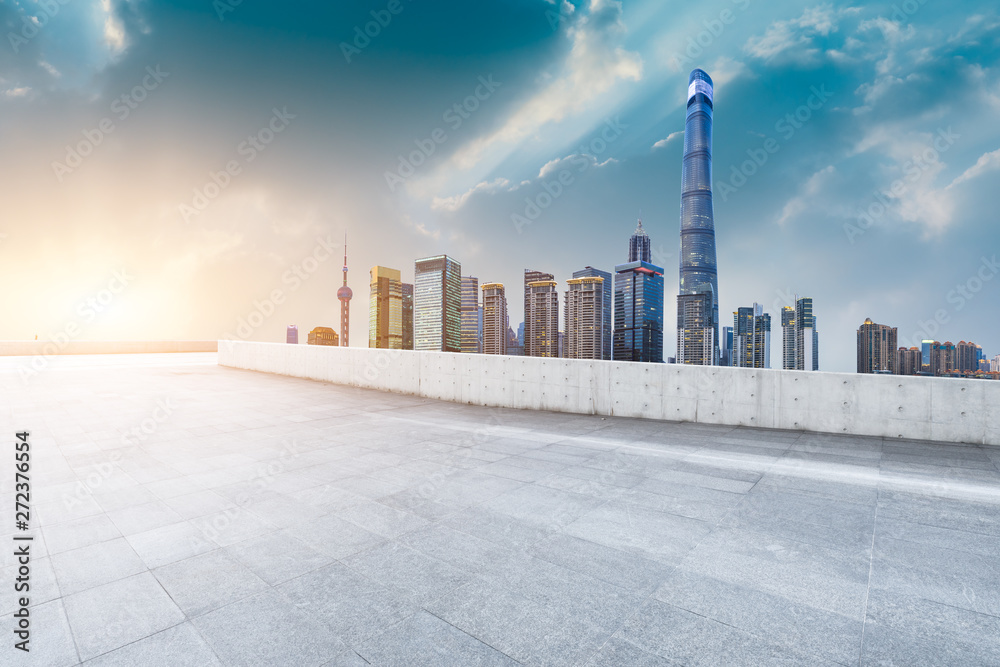 Shanghai skyline and modern city skyscrapers with empty floor at sunset,China