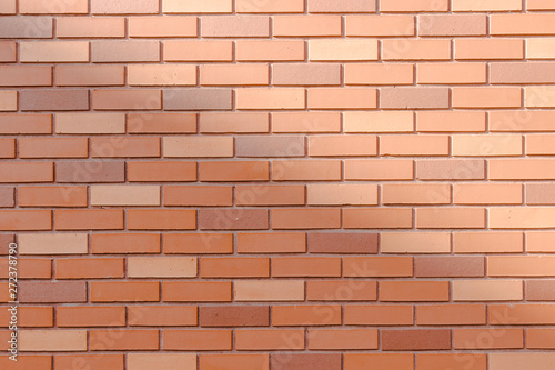 red bricks wall half shadow
