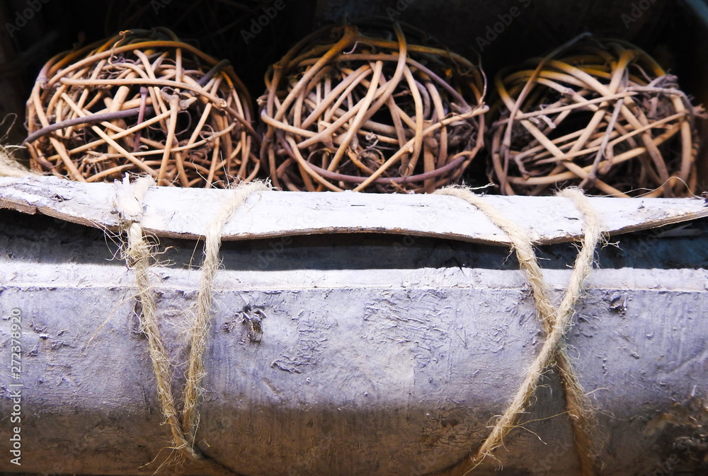 Round balls of straw, dry coconuts and birch bark scrolls. Postcard. Round balls of straw, dry coconuts and birch bark scrolls. Postcard.